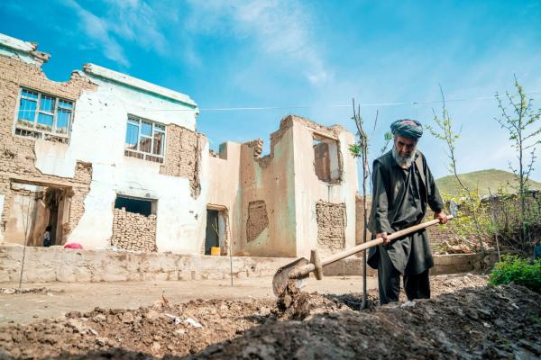 Muhammad Zubaid plants a tree in front of the ruins of his destroyed house in Janat Bagh village in north-eastern Afghanistan’s Kunduz province.  